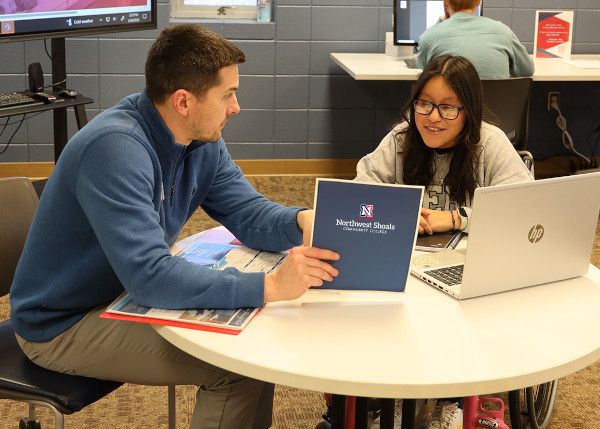 A student advisor counseling a student.